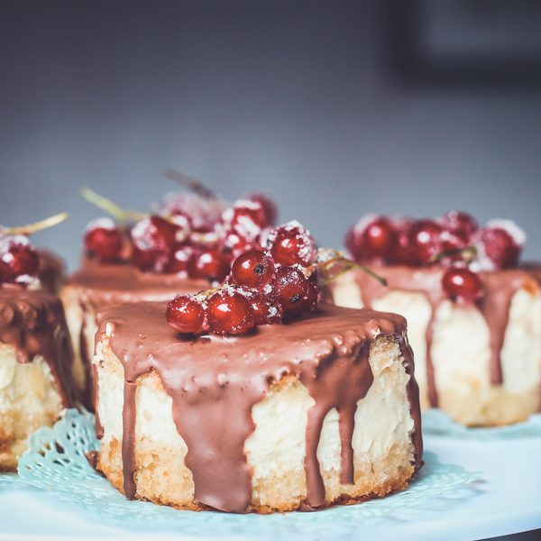 Small cakes topped with cherries and chocolate