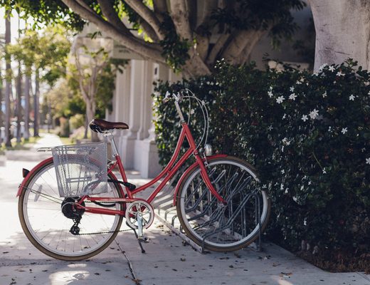 Bicycle leaning on a wall in a narrow street