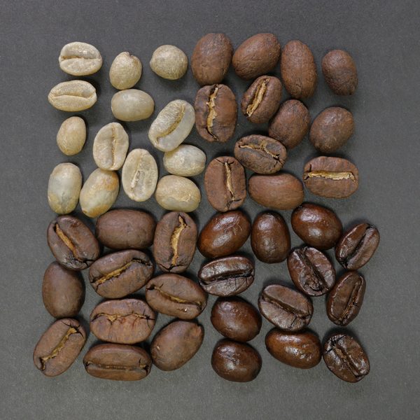 Green and roasted coffee beans laid out in a square