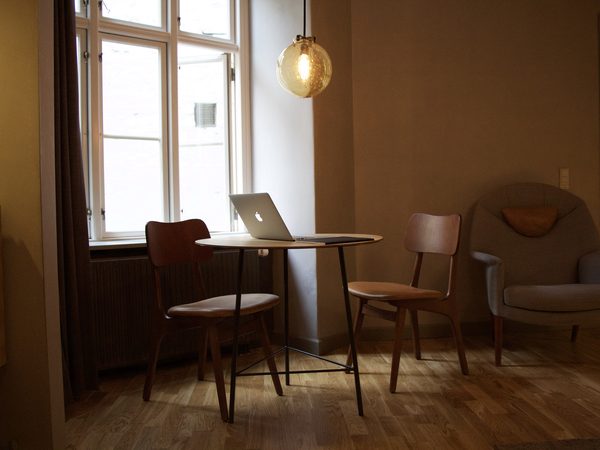 Laptop on a low table in a living room