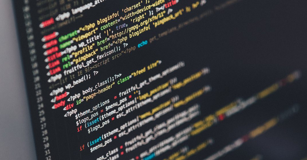 Colorful lines of code on a dark monitor
