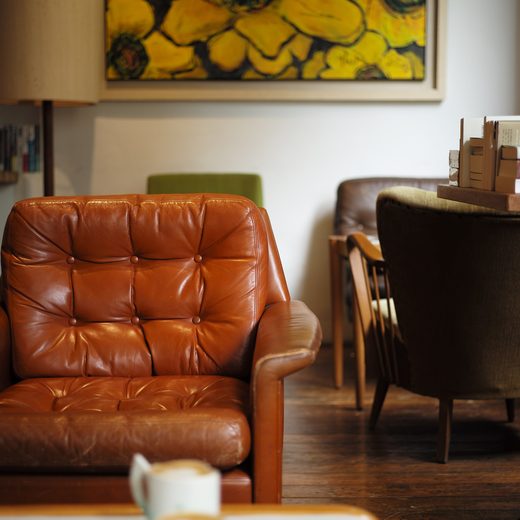 Brown leather armchair in a warm living room