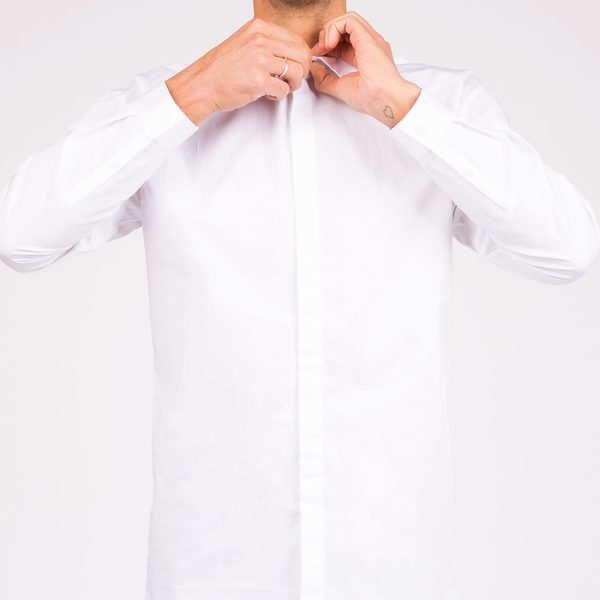 Plain white button-up shirt on a pale background