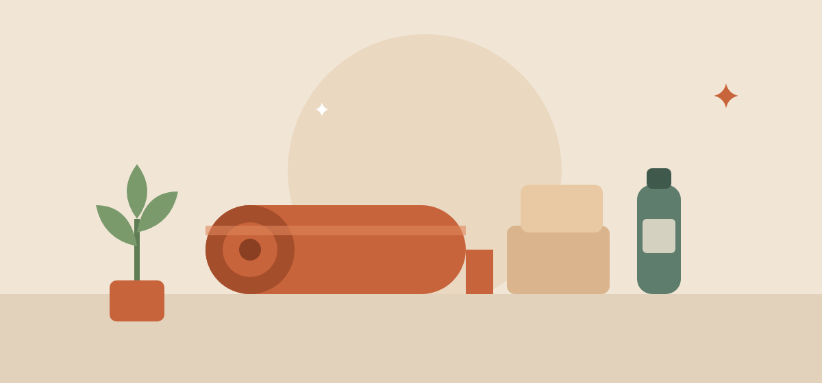 A rolled terracotta yoga mat with two blocks, a water bottle and a small plant