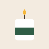 White candle with a green band