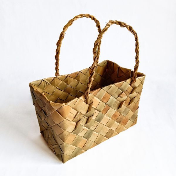 Woven palm market basket with two braided handles