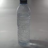 Clear water bottle on a grey surface